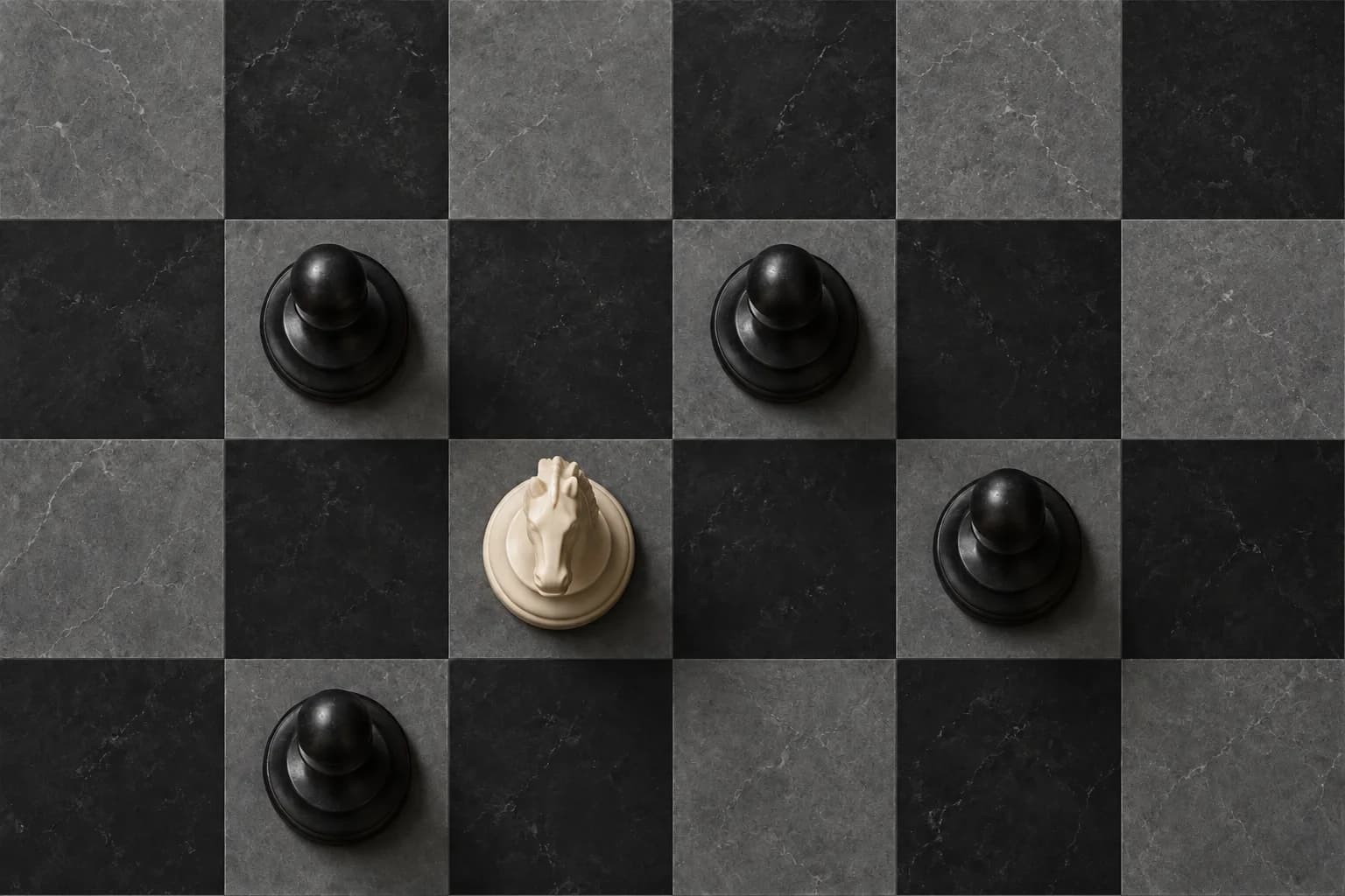Top-down view of an ivory knight and four charcoal pawns centered on alternating light and dark chessboard squares